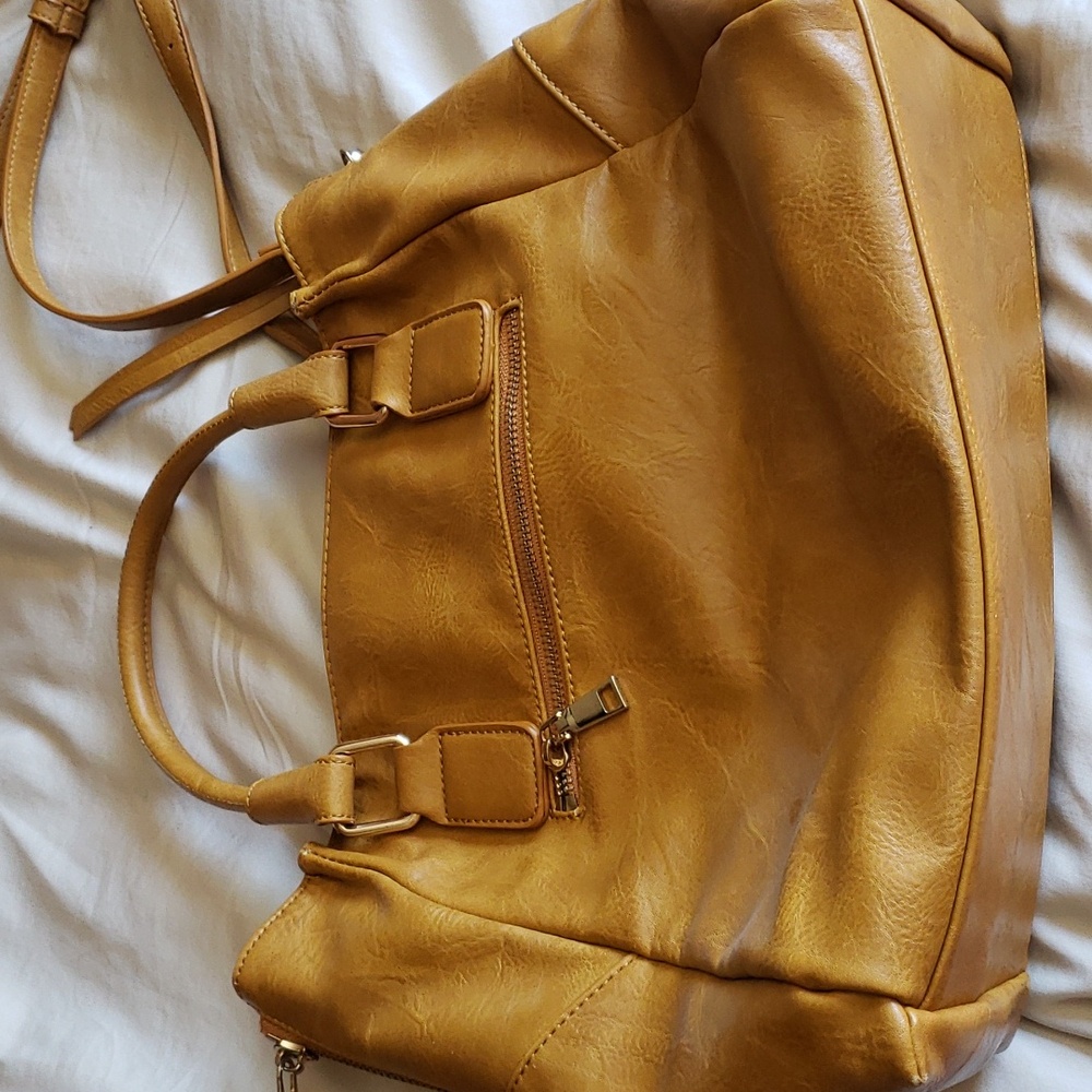 Tan leatherish (not sure if it is leather) urban expressions handbag